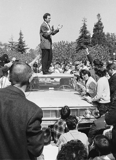 Mario Savio speaking from the top of the police car.