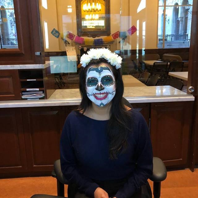 Gemma Givens, Front Desk Operations Coordinator by day, skull face painter at Dia de los Muertos Coffee Hour!