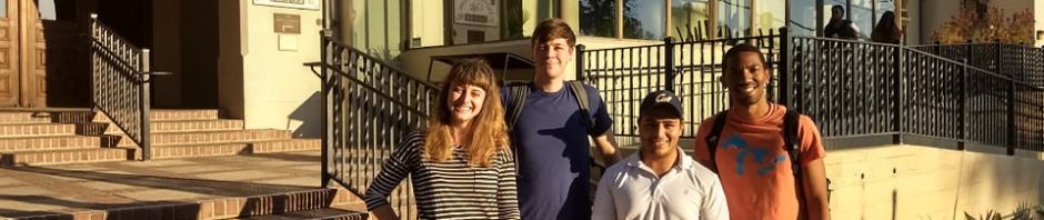 Benny Corona with residents in front of I-House