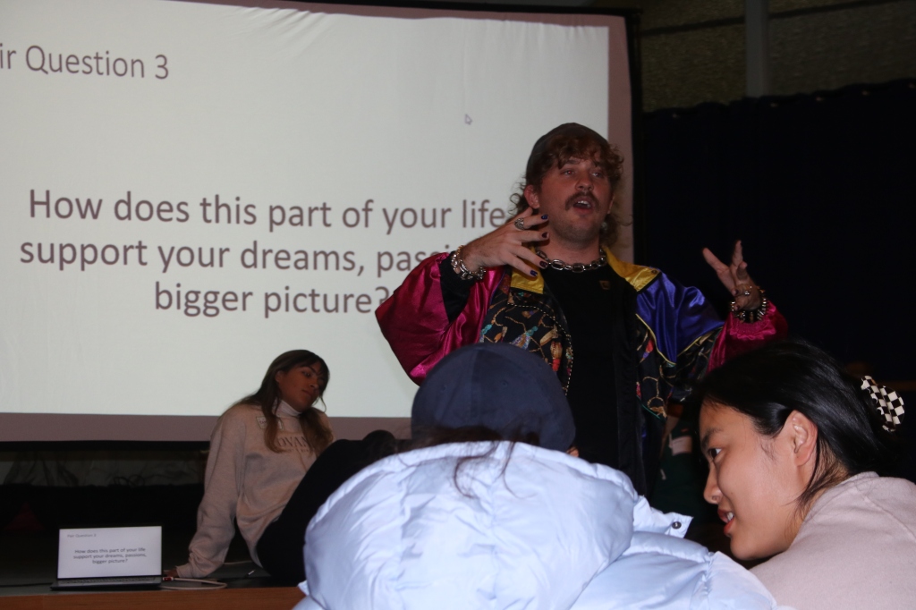 Hawk Anderson, the residents' support manager, explaining the third discussion question for residents to talk through in their group.