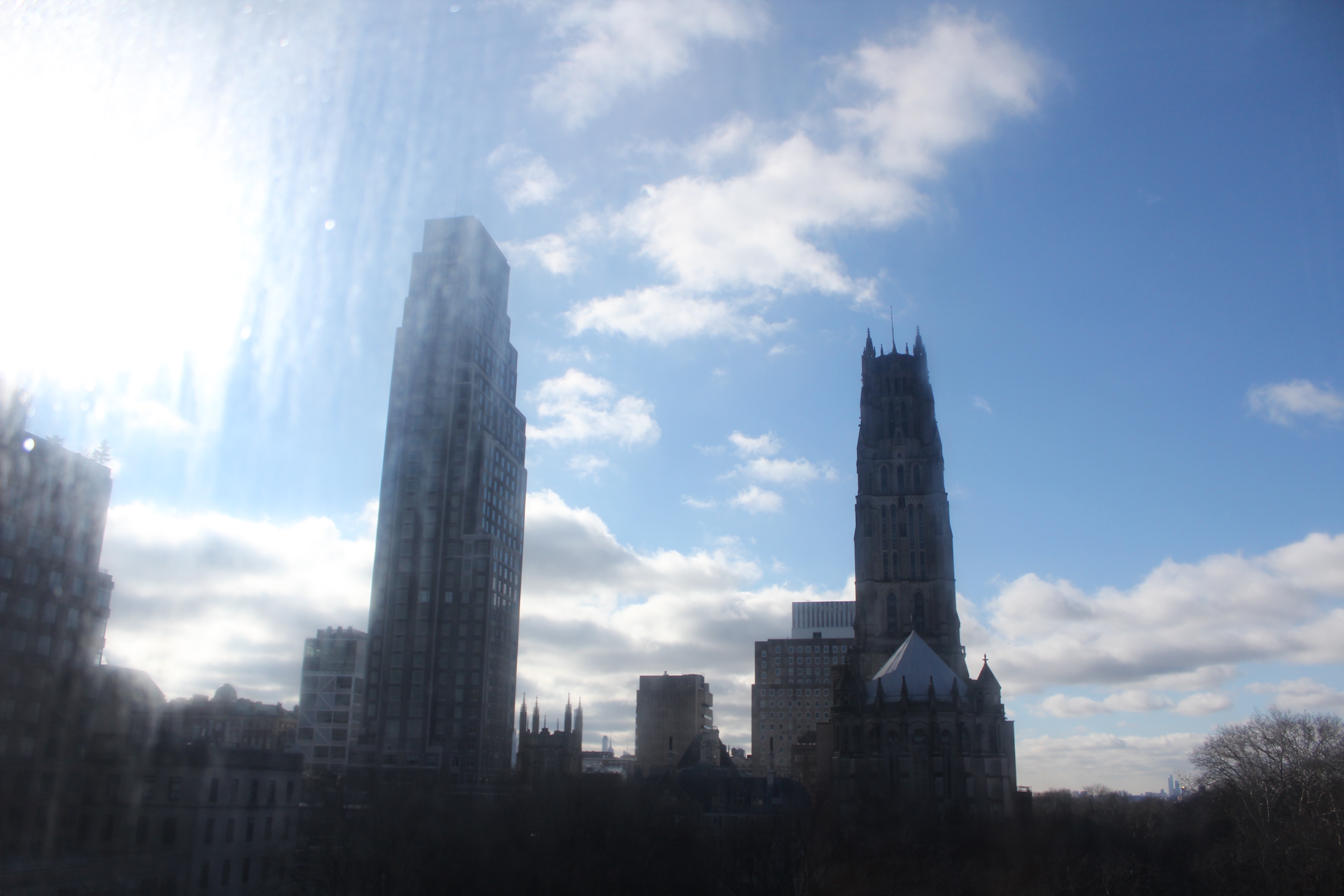 A view of a church from a room window.